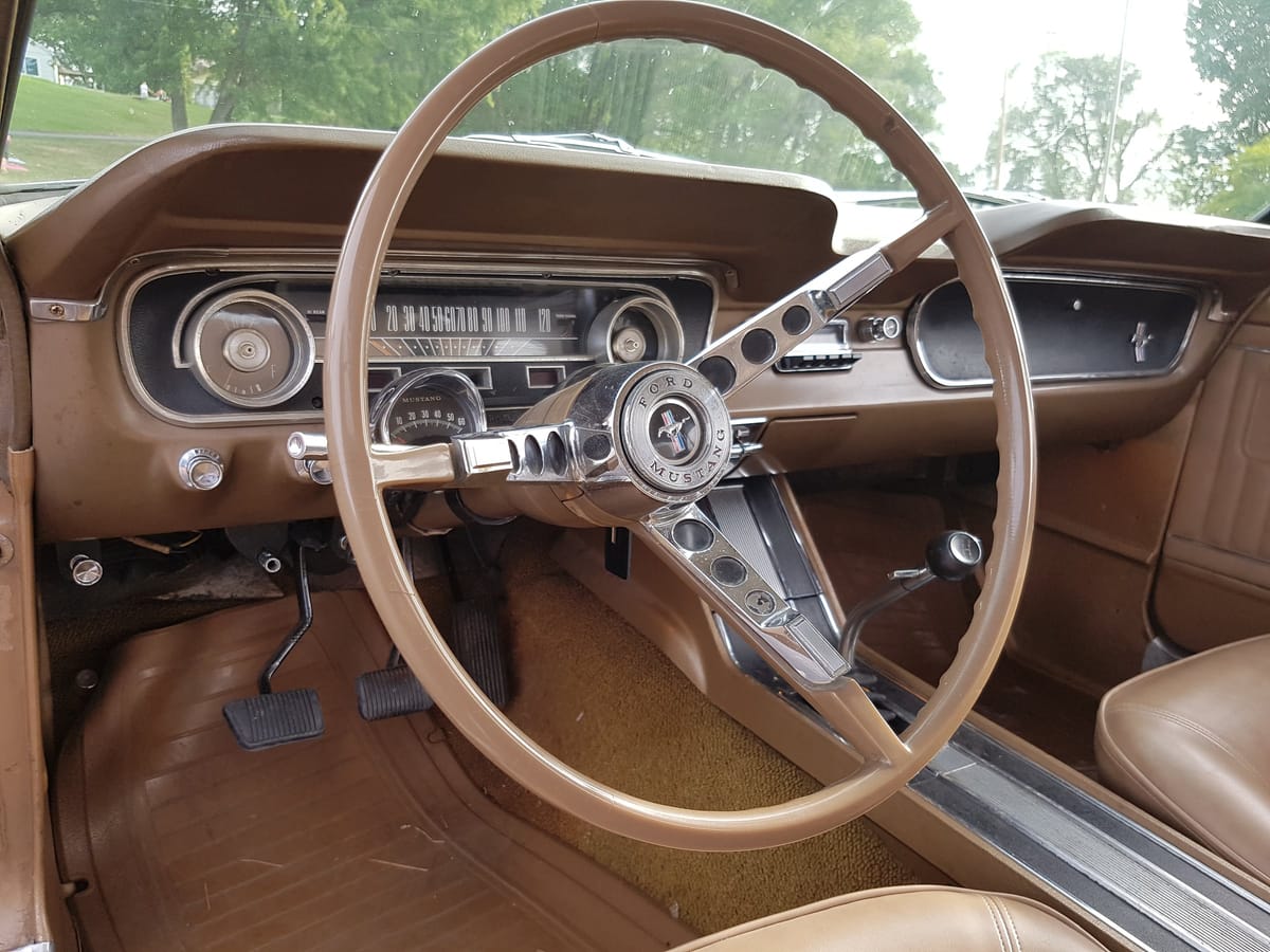 The Palomino interior and four-speed of the freshly bought 1965 K-code