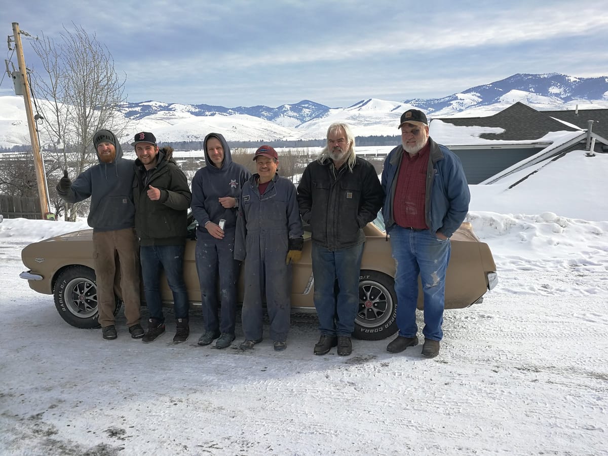The Montana crew in front of the Mustang on handover day