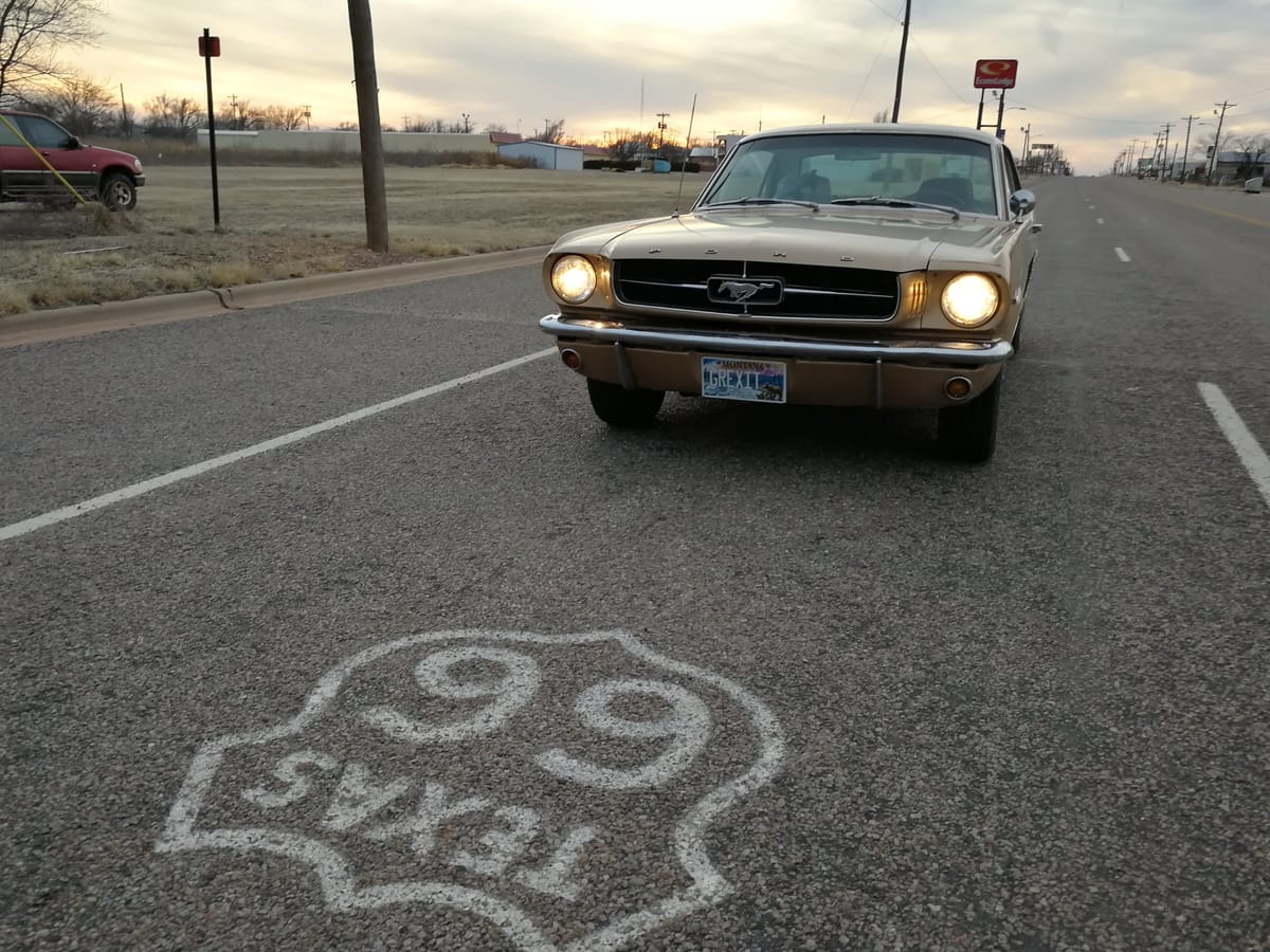 The Mustang over a Texas Route 66 shield painted on the asphalt