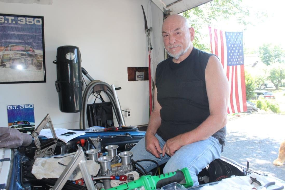 Jim at Blue's open engine bay, the Webers in view