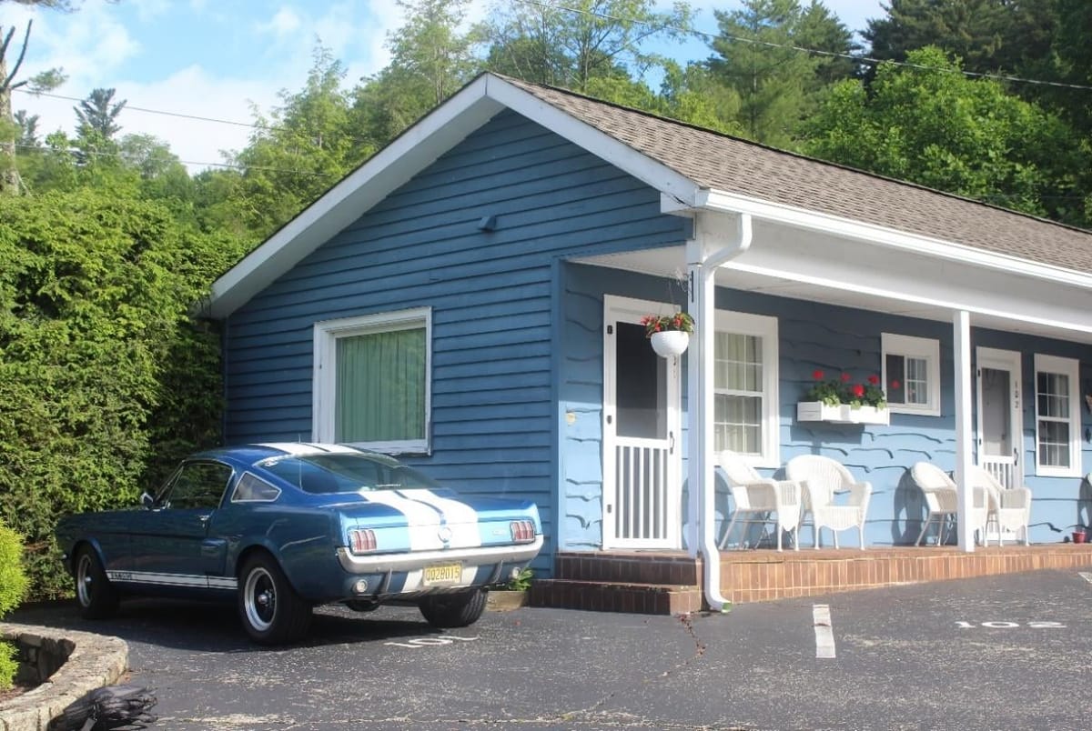 Blue parked outside one of the small motels along the way